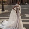 Глоуз 5 Патрисия Кутюр <p style="text-align: justify;">Это свадебное платье облегающего силуэта с открытыми плечами и спинкой на молнии выглядит просто великолепно! Использование пайеток придаёт платью невероятный блеск и праздничность, что делает его идеальным выбором для свадьбы. В сочетании с фатином, платье будет легким и воздушным, создавая эффект нежности.
Кейп — это интересный и стильный элемент, который может добавить элегантности в образ невесты. Его также можно носить, если вы хотите закрыть плечи в более прохладную погоду.
Такой дизайн прекрасно подчеркивает изящность фигуры и станет настоящей изюминкой вашего свадебного наряда. Это платье подойдет как для классической, так и для современной свадьбы, а также для различных стилей оформления.</p>
<iframe src="https://www.youtube.com/embed/zevI0G1IQRE" width="auto" height="600" frameborder="0" allowfullscreen="allowfullscreen"></iframe>